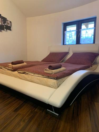 A bed or beds in a room at Dovolenkový dom Dubak