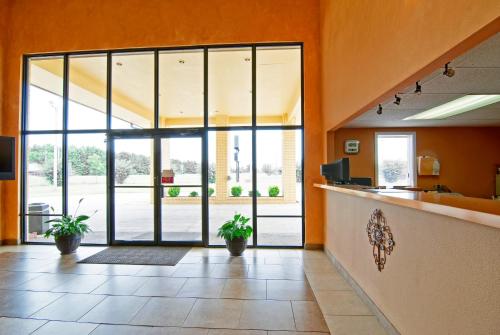 an office lobby with a large glass door at Executive Inn & Suites Prescott in Prescott
