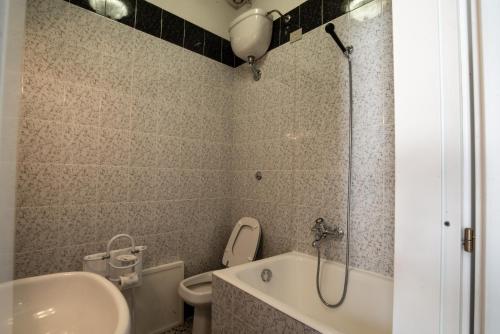 a bathroom with a shower and a sink and a toilet at Hotel AeR BJ Vittoria in Cagliari