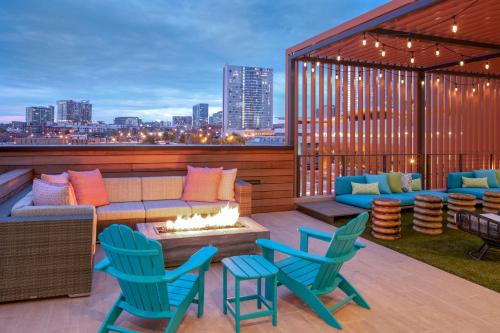 a patio with a couch and chairs and a fire pit at Margaritaville Vacation Club - Nashville in Nashville