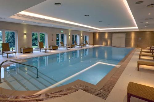 a large swimming pool in a hotel room at Best Western Lamphey Court Hotel and Spa in Lamphey