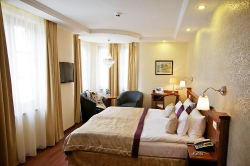 Posteľ alebo postele v izbe v ubytovaní Gold Hotel Budapest