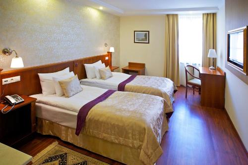 Posteľ alebo postele v izbe v ubytovaní Gold Hotel Budapest