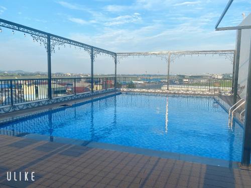 a large swimming pool on top of a building at Paragon House and Residence in Hanoi