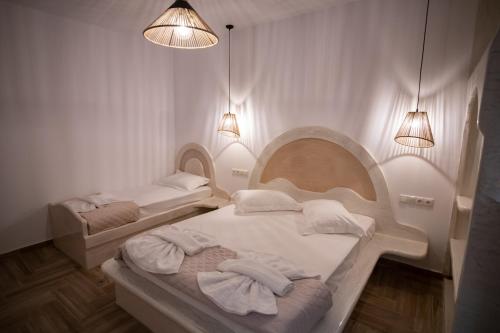 Ліжко або ліжка в номері Alta Vista Naxos