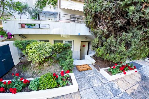 an aerial view of a house with flowers at Xsoma Flats "Coral" in Thessaloniki