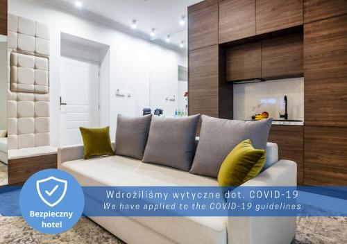 a living room filled with furniture and a couch at Aparthotel Rakowicka Residence in Krakow