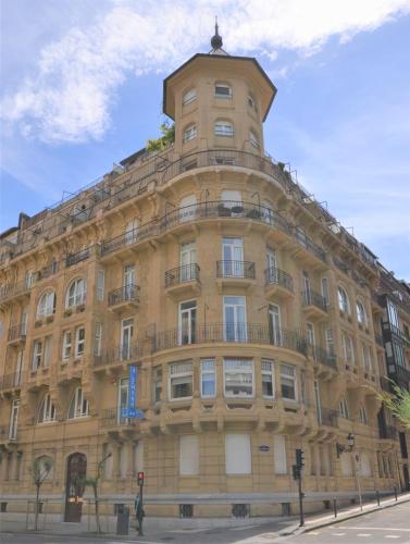 a large building with a tower on top of it at Pensión Alemana in Donostia-San Sebastián