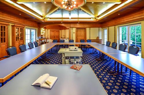a large conference room with a long table and chairs at Hotel Landhaus Krombach in Elkenroth