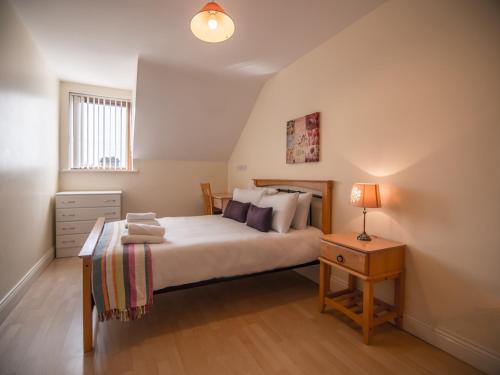 Postel nebo postele na pokoji v ubytování Donegan Court Aparthotel