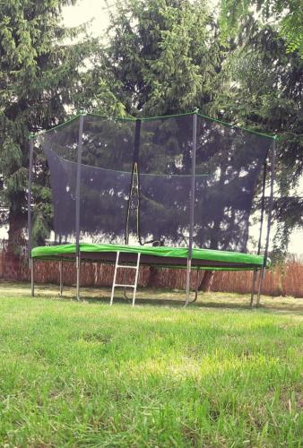 a batting cage with a tennis racket on it at Ustronne Domki in Ustronie Morskie