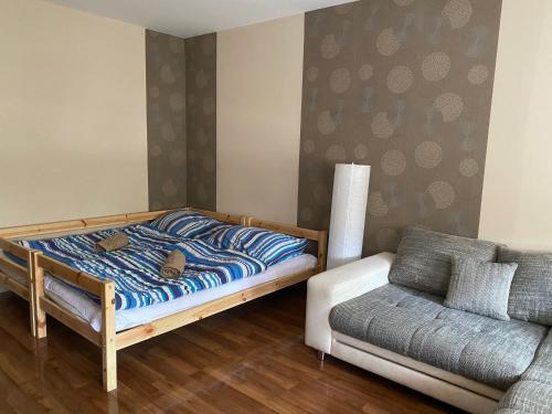 A bed or beds in a room at Virág Vendégház