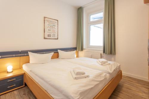 Ein Bett oder Betten in einem Zimmer der Unterkunft Villa Meeresgruss