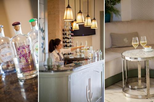 a woman standing at a bar with wine glasses at Hotel Lido in Alassio