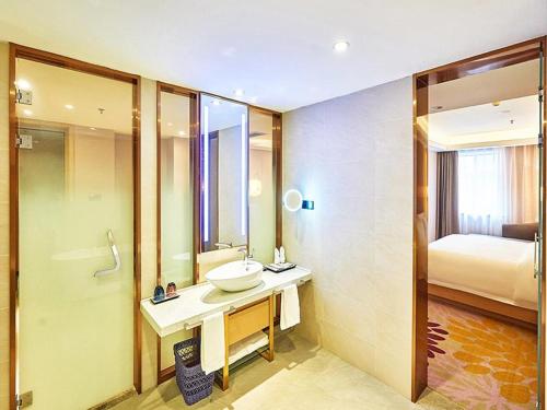 Ένα ή περισσότερα κρεβάτια σε δωμάτιο στο Lavande Hotel Changchun Peoples Square