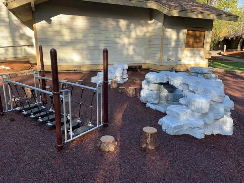 a bunch of snow piled up in front of a house at The Pines at Sunriver in Sunriver