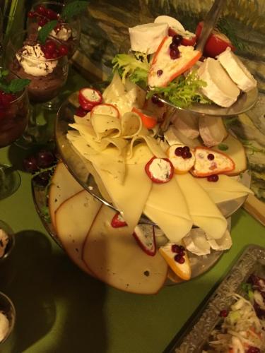 a plate of cheese and other foods on a table at Pension Haus Fürstenberg in Grünhain-Beierfeld