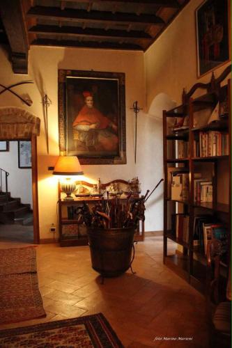 a living room with a lamp and a painting on the wall at Castello di Cernusco Lombardone in Cernusco Lombardone