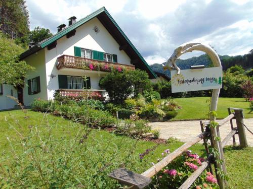 a house with a sign in front of it at Ferienwohnung Lange in Göstling an der Ybbs