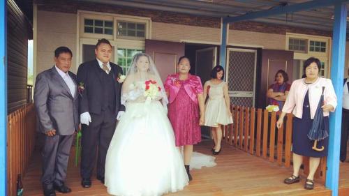 a bride and groom and their wedding party at Taroko Little Fish in Xincheng