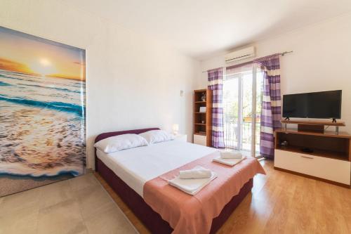 Postel nebo postele na pokoji v ubytování Apartment Livaja