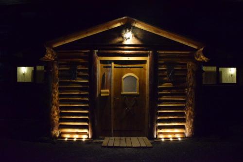 a front door of a house at night at Apartman Dunja -Ski skola in Kopaonik