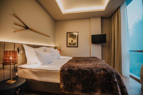 Letto o letti in una camera di Balvanyos Resort - Peakture Hotel & Grand Hotel Balvanyos