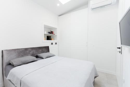Posteľ alebo postele v izbe v ubytovaní Apartman Amore