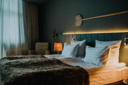 Letto o letti in una camera di Balvanyos Resort - Peakture Hotel & Grand Hotel Balvanyos