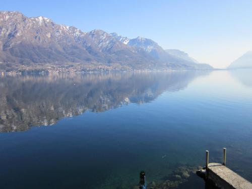 a view of a large body of water with mountains at casa indipendente "IL SOLE DELLE GRIGNE" in Bellagio