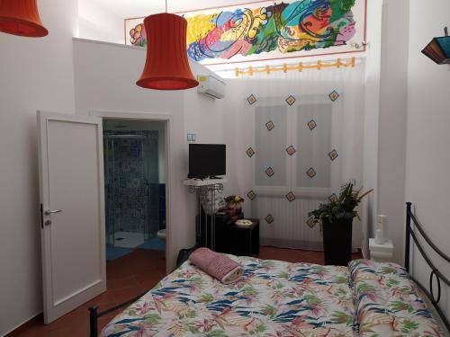 a bedroom with a bed and a red lamp at B&B La Casa Di Giò in Lanciano