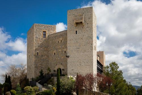 a large brick building on top of a hill at Parador de Jaén in Jaén