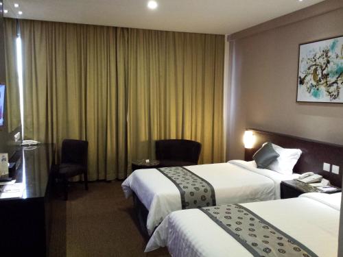 Postel nebo postele na pokoji v ubytování Hotel Royal