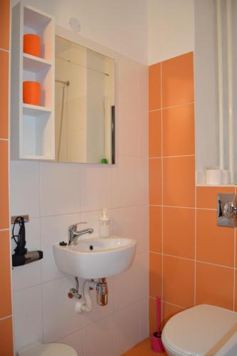 a bathroom with a sink and a toilet at Pension Nika in Prague