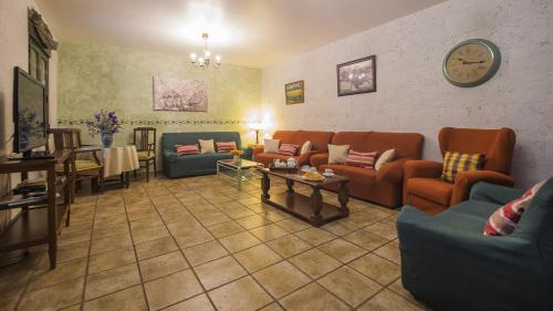 a living room with couches and a table at Los Laureles 2 in Urda