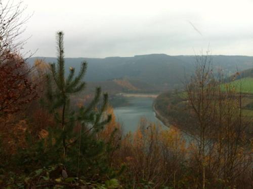 a view of a river in the middle of a valley at Hotel Val De La Cascade in Stavelot