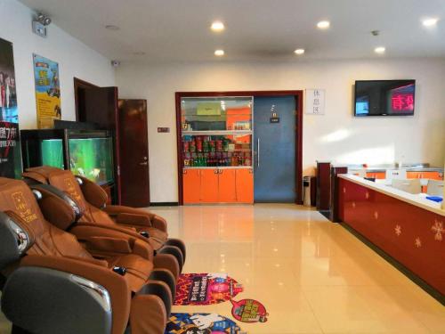 a waiting room with brown chairs in a store at 7Days Inn Tianjin Zhongshan Road North Station in Tianjin