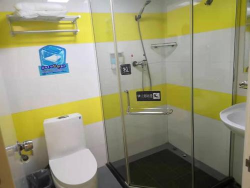 a bathroom with a shower and a toilet and a sink at 7Days Inn Suzhou Xuguan in Suzhou