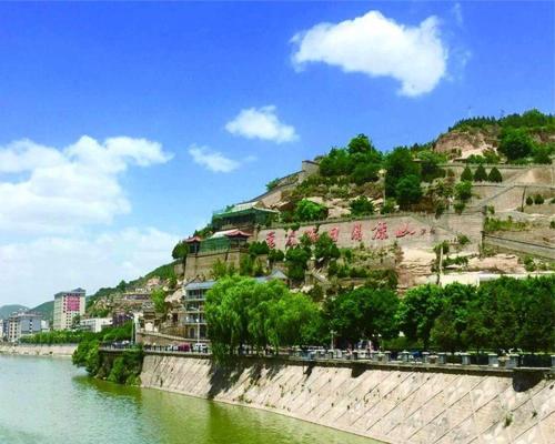 a hill next to a body of water at 7Days Inn Yanan East Street Bus Station in Yan'an