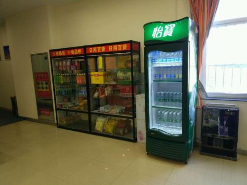a convenience store with a drink cooler in a store at 7Days Inn Yanan East Street Bus Station in Yan'an