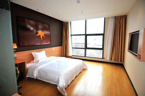 7Days Inn Suzhou Industrial Park Sheng Pu Tongjiang Road 객실 침대