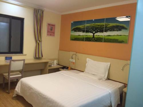 7Days Inn Xuancheng High Speed Stationにあるベッド