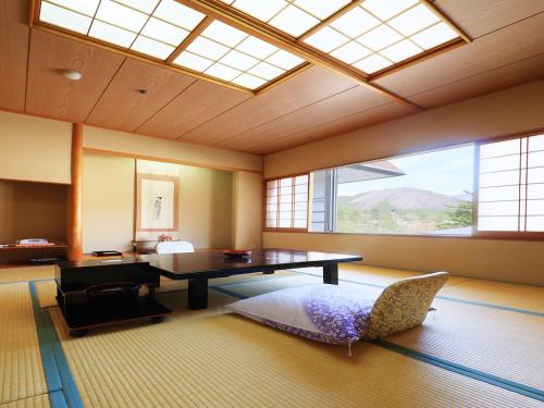 Ένα ή περισσότερα κρεβάτια σε δωμάτιο στο Kinugawa Onsen Hana no Yado Matsuya