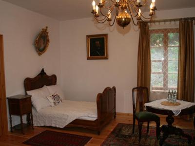 Postel nebo postele na pokoji v ubytování Dworek Karpińskich