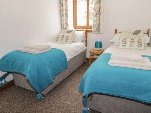 Katil atau katil-katil dalam bilik di Middlefell View Cottage