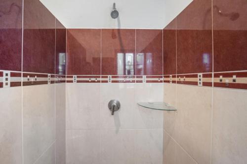a bathroom with a shower with a faucet at Villas Akalan in Tulum