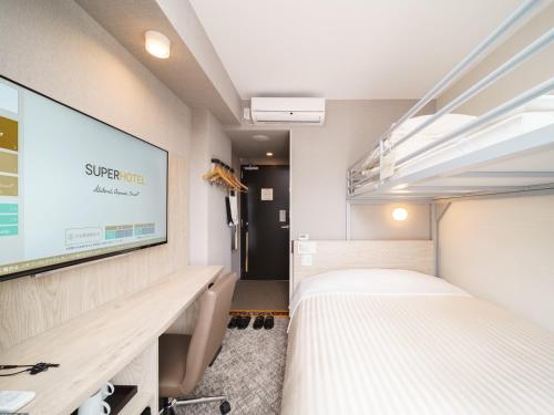 Postel nebo postele na pokoji v ubytování Super Hotel Saitama Kawagoe