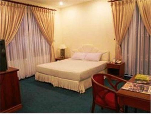 Cama o camas de una habitación en Champasak Palace Hotel