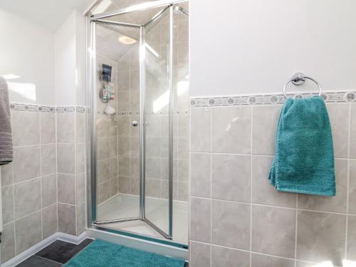 a shower with a glass door in a bathroom at Little Acorn in Barnstaple