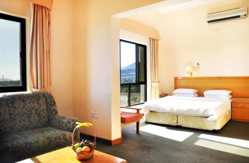 En eller flere senger på et rom på Jabal Akhdhar Hotel